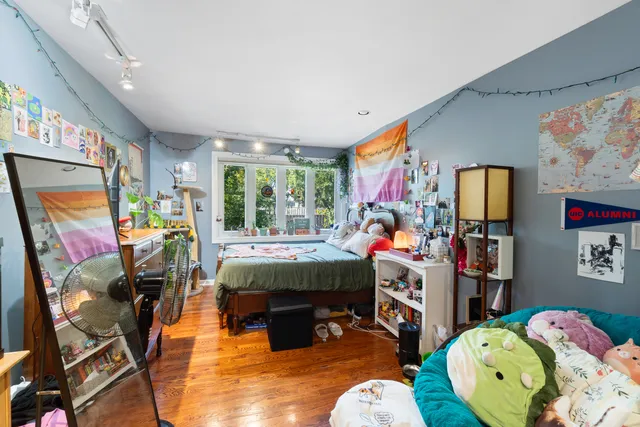 a bathroom with a glass shower door and a sink