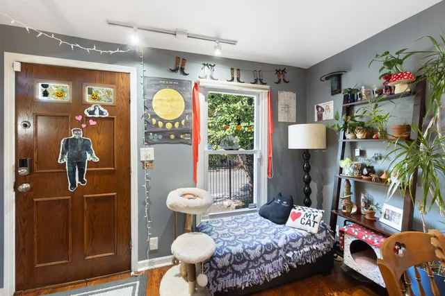 a bedroom with a bed and a window