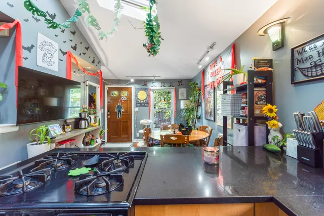 a bedroom with a bed and a painting on the wall