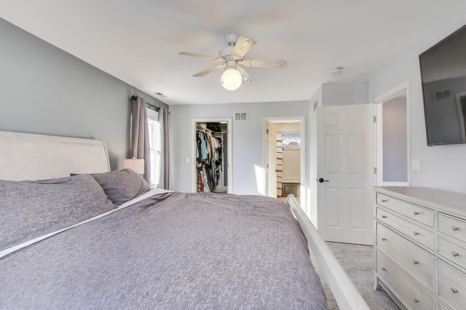 218 North School Street Mount Prospect, IL 60056 - Photo 17 of 30 a bedroom with a large bed and a chandelier