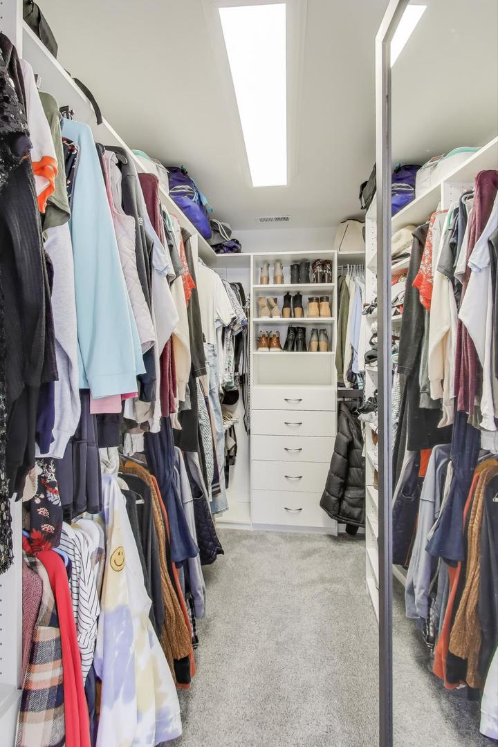 218 North School Street Mount Prospect, IL 60056 - Photo 19 of 30 a view of walk in closet with clothes