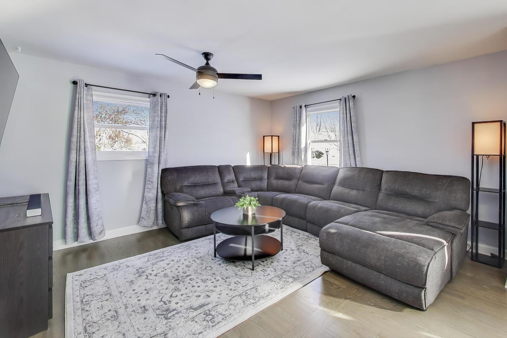 218 North School Street Mount Prospect, IL 60056 - Photo 4 of 30 a living room with furniture a rug and a window