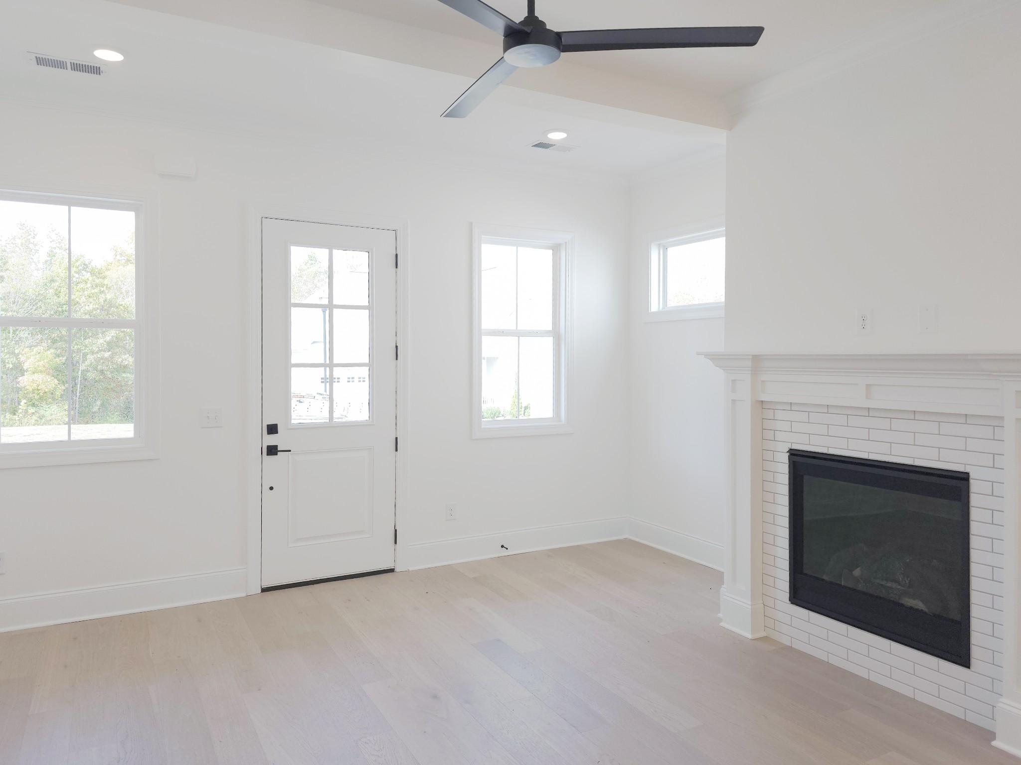 7147 Frances Street Fairview, TN 37062 - Photo 4 of 45 an empty room with windows and fireplace