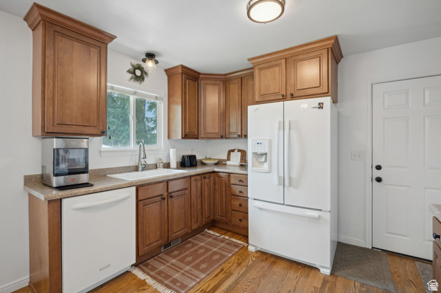495 North 250 West Springville, UT 84663 - Photo 7 of 35 Kitchen featuring white appliances, wood finish cabinets, light countertops, and light wood-style floors