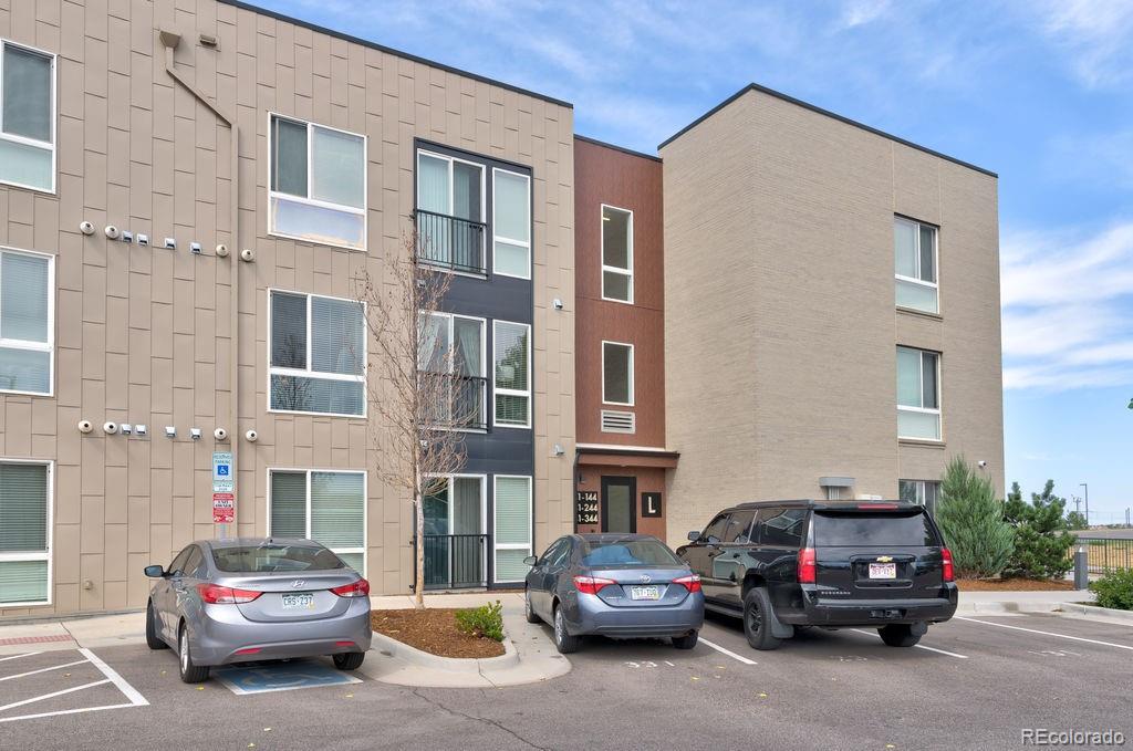 8475 East 36th Avenue, Unit 241 Denver, CO 80238 - Photo 11 of 11 a car parked in front of a building
