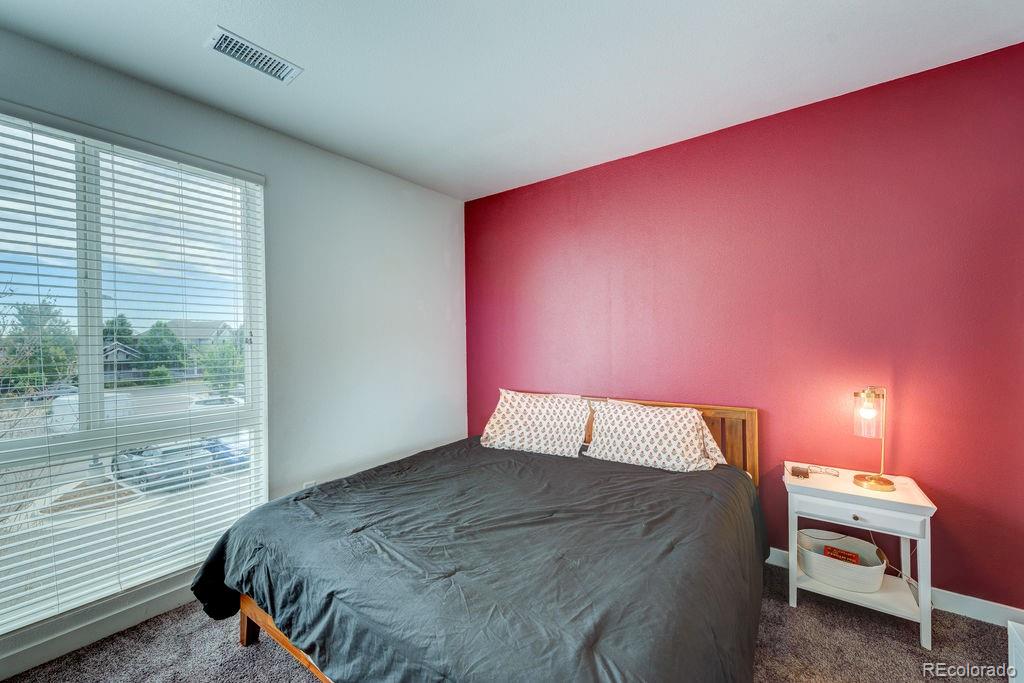 8475 East 36th Avenue, Unit 241 Denver, CO 80238 - Photo 5 of 11 a bedroom with a bed and a window