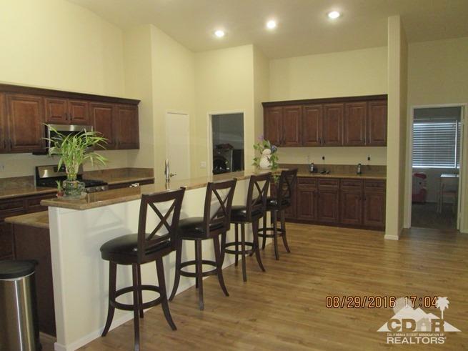 41643 Petersfield Road Bermuda Dunes, CA 92203 - Photo 3 of 29 a kitchen with a table and chairs in it