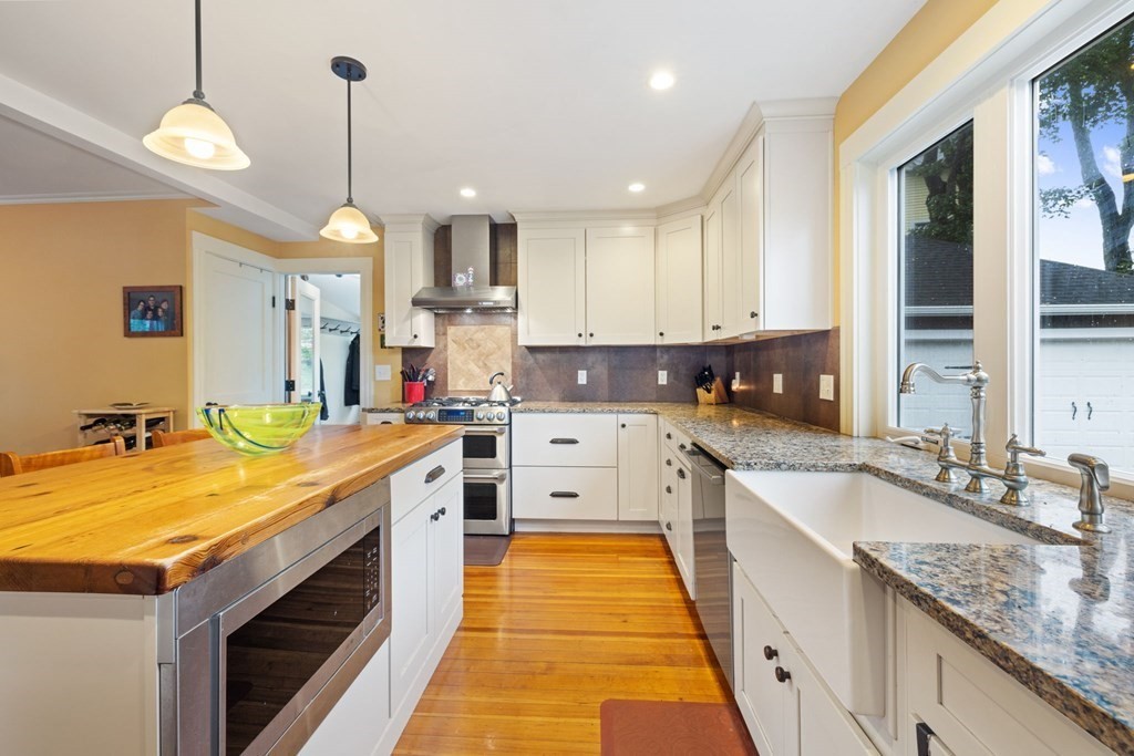 5 Belfry Terrace Lexington, MA 02421 - Photo 13 of 40 a large kitchen with stainless steel appliances granite countertop a sink and dishwasher a stove with wooden floor