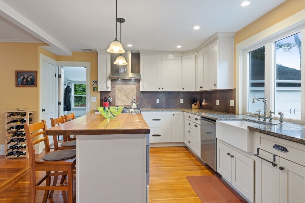 5 Belfry Terrace Lexington, MA 02421 - Photo 15 of 40 a kitchen that has a lot of white cabinets and stainless steel appliances
