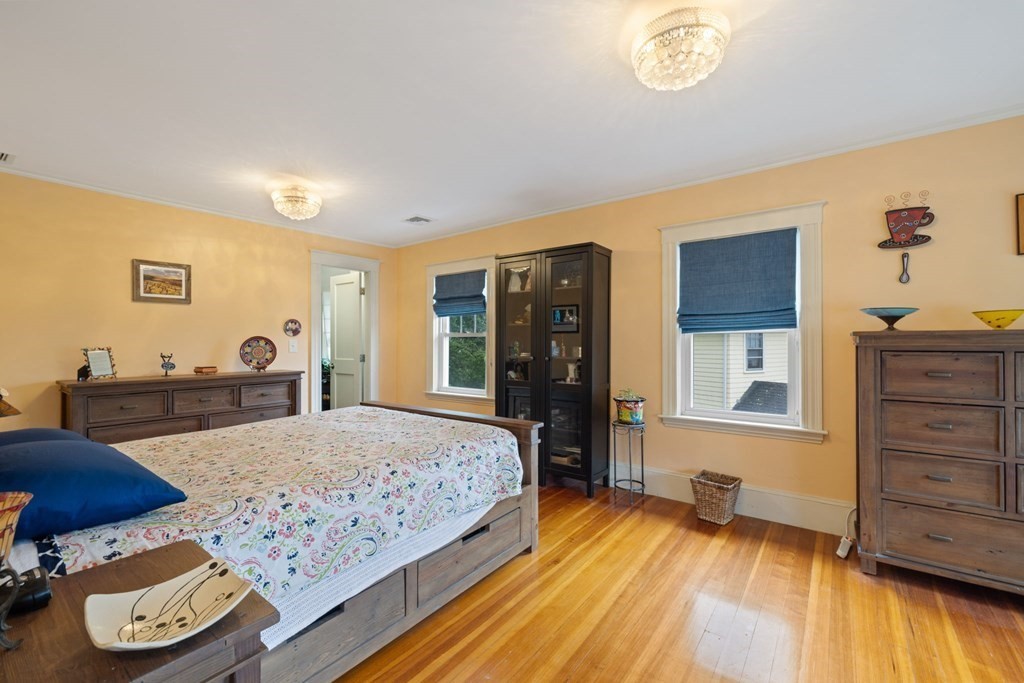 5 Belfry Terrace Lexington, MA 02421 - Photo 22 of 40 a bedroom with a bed and wooden floor
