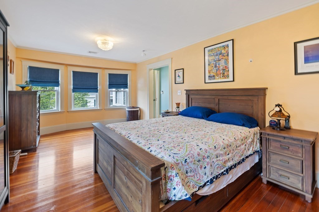 5 Belfry Terrace Lexington, MA 02421 - Photo 23 of 40 a bedroom with a bed and a dresser next to a window