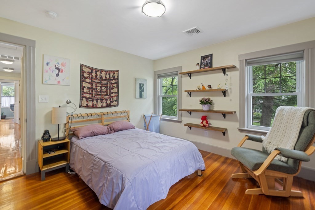 5 Belfry Terrace Lexington, MA 02421 - Photo 28 of 40 a bedroom with a bed and wooden floor