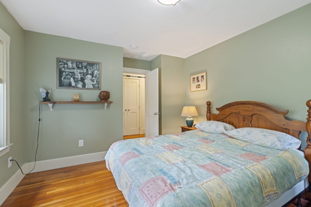 5 Belfry Terrace Lexington, MA 02421 - Photo 30 of 40 a bedroom with a bed and wall painting