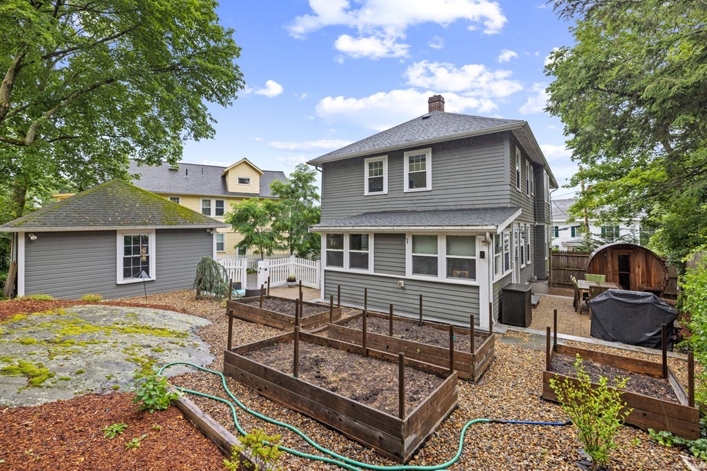 5 Belfry Terrace Lexington, MA 02421 - Photo 39 of 40 a front view of house with yard outdoor seating and barbeque oven