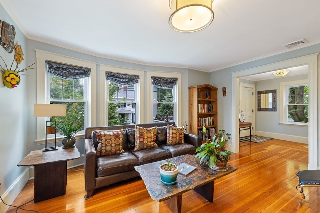 5 Belfry Terrace Lexington, MA 02421 - Photo 5 of 40 a living room with furniture wooden floor and a large window