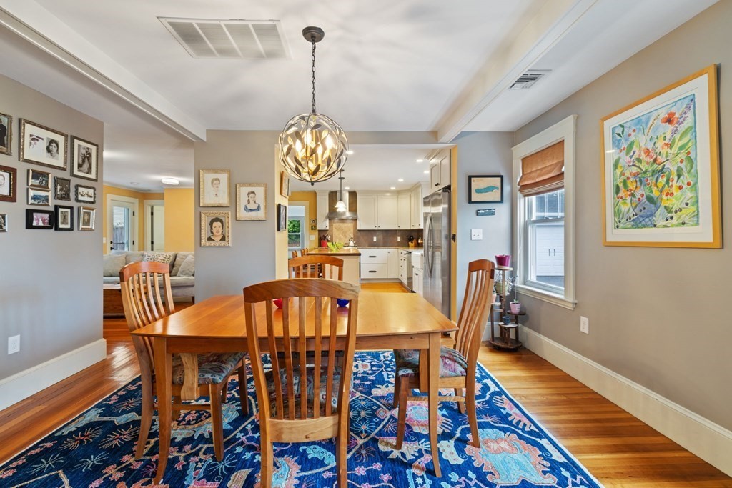 5 Belfry Terrace Lexington, MA 02421 - Photo 8 of 40 a view of a dining room with furniture a chandelier and wooden floor