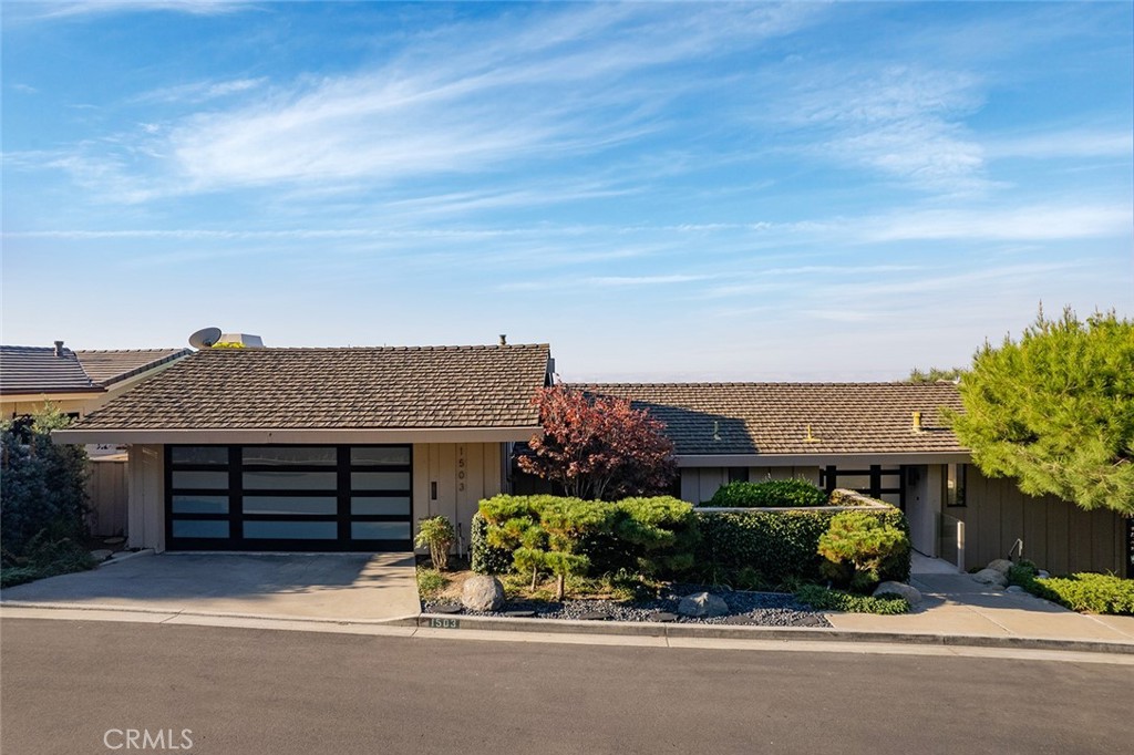 front view of a house with a street