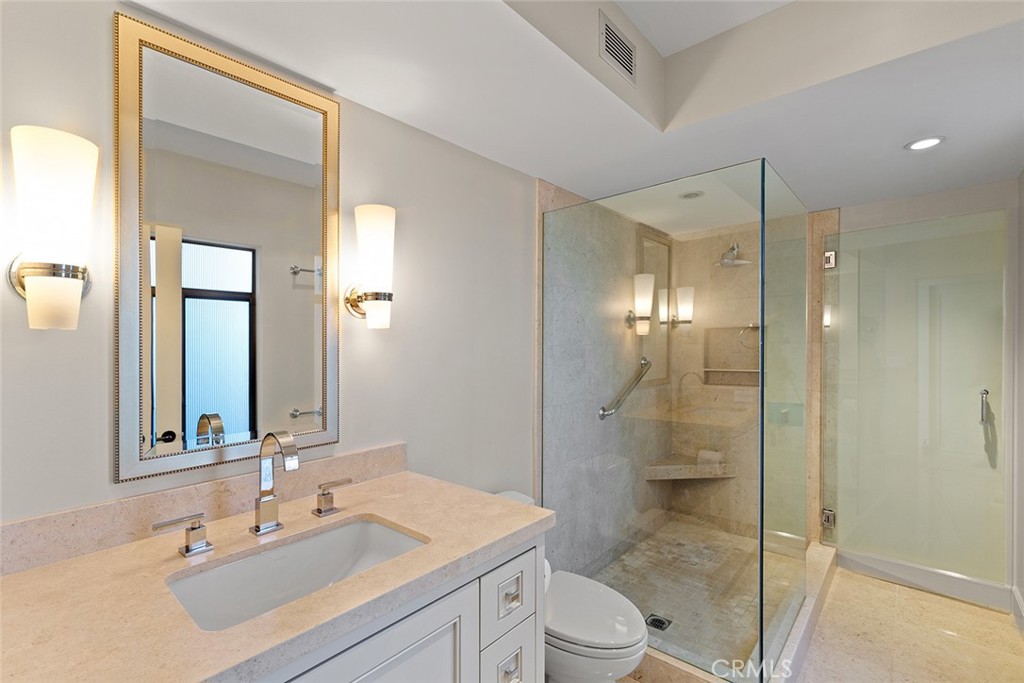 1503 Emerald Bay Laguna Beach, CA 92651 - Photo 27 of 32 a bathroom with a sink a toilet and shower