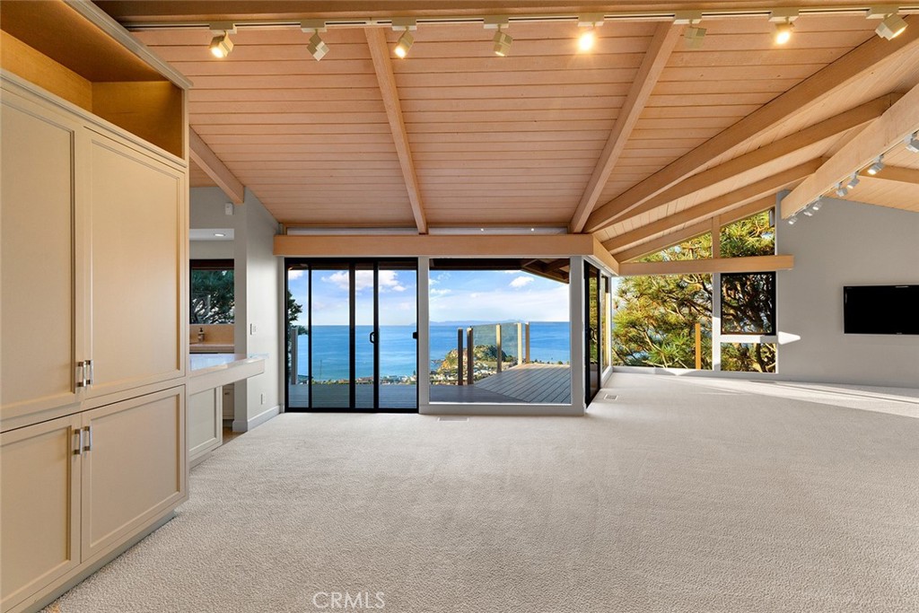 1503 Emerald Bay Laguna Beach, CA 92651 - Photo 9 of 32 a view of a room with wooden floor and windows