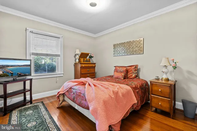 a bedroom with bed and window