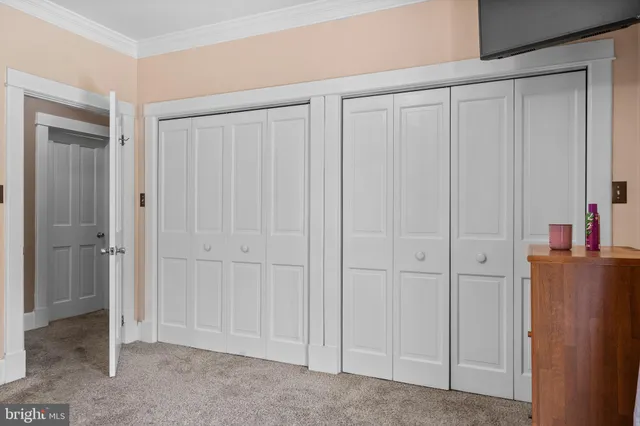 a view of a livingroom with kitchen space