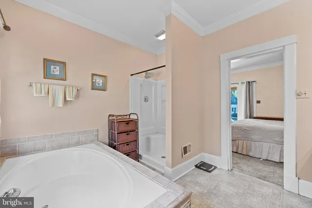 a bathroom with a tub and a sink