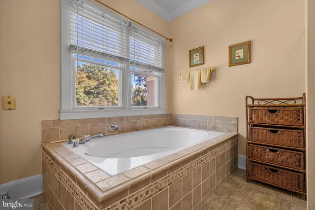 a white bath tub sitting next to a window