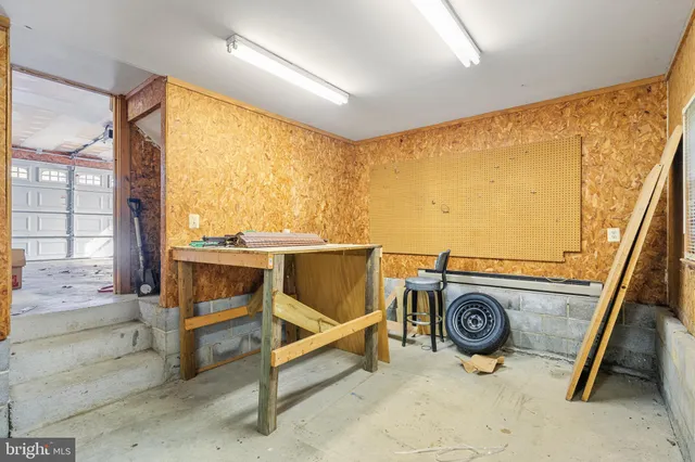 a view of a chairs and table on the wooden deck