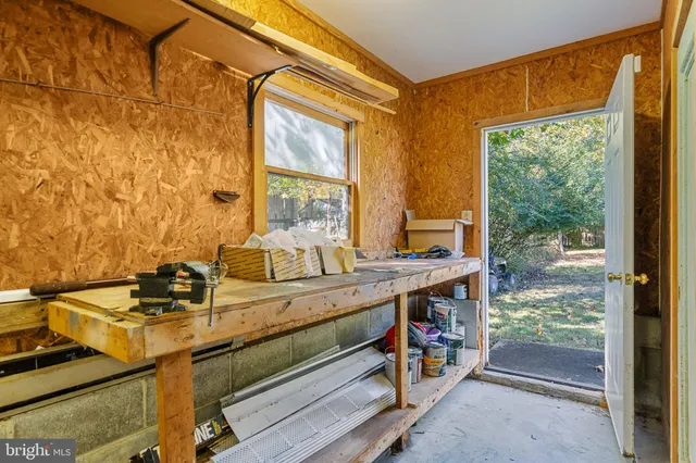a view of a chairs and table on the wooden deck