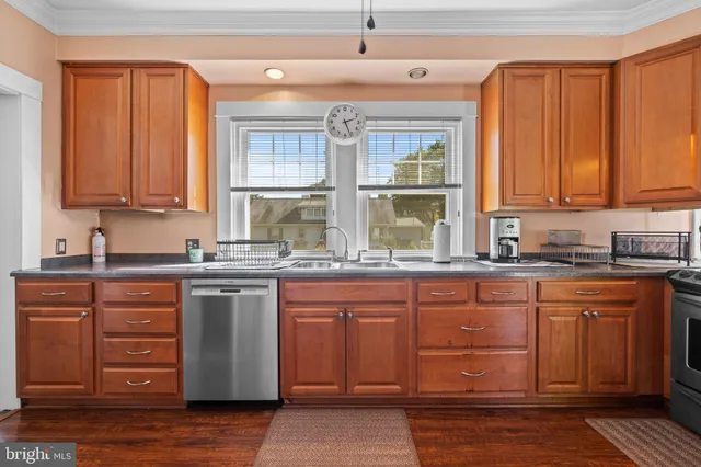 a kitchen with stainless steel appliances granite countertop a sink and cabinets