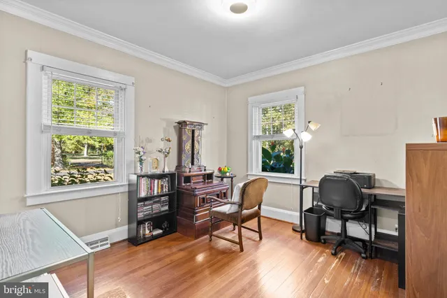 a workspace with furniture and a window