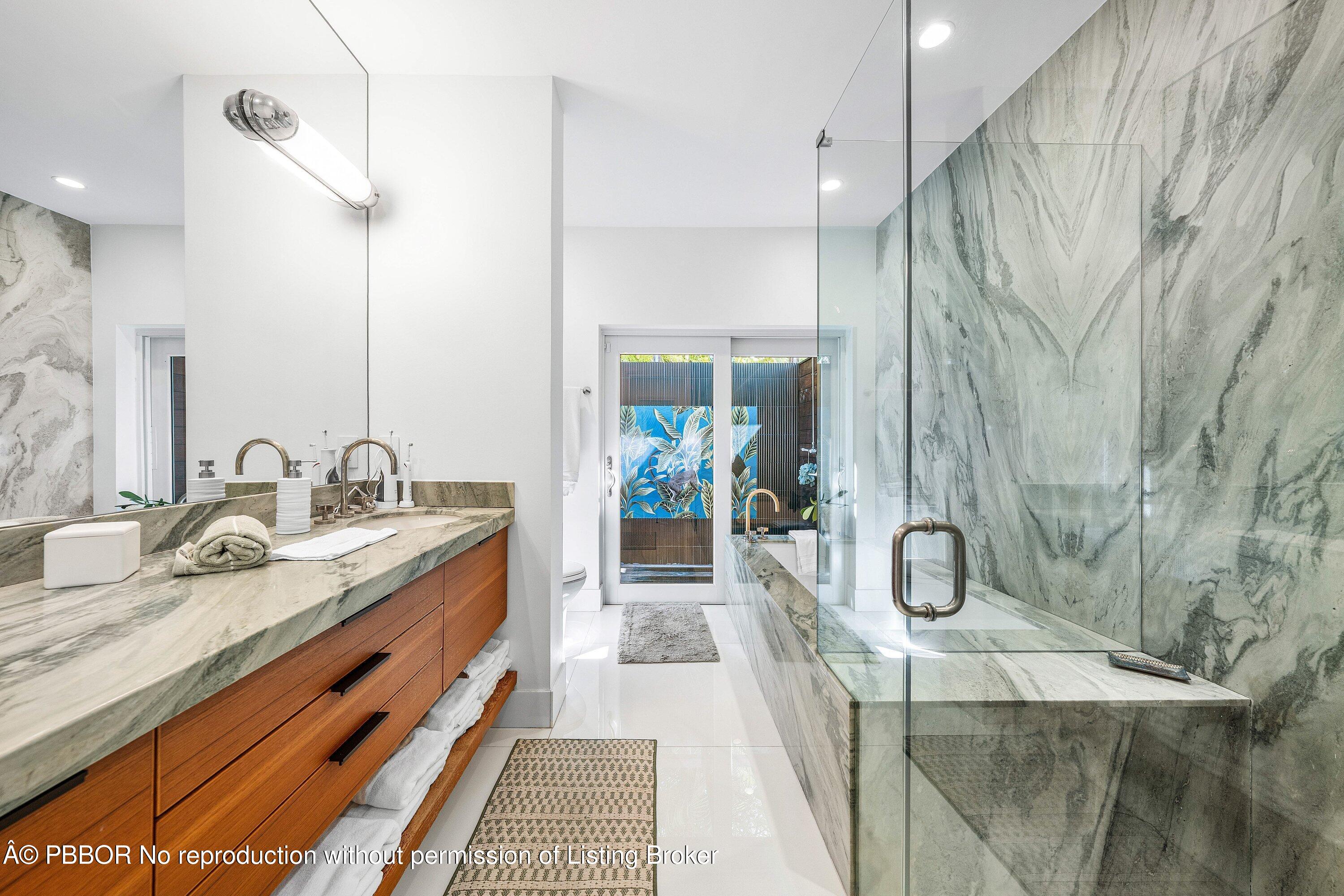 50 Spoonbill Road Lantana, FL 33462 - Photo 16 of 37 a bathroom with a double vanity sink and a mirror