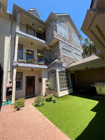 a view of a house with a yard and plants