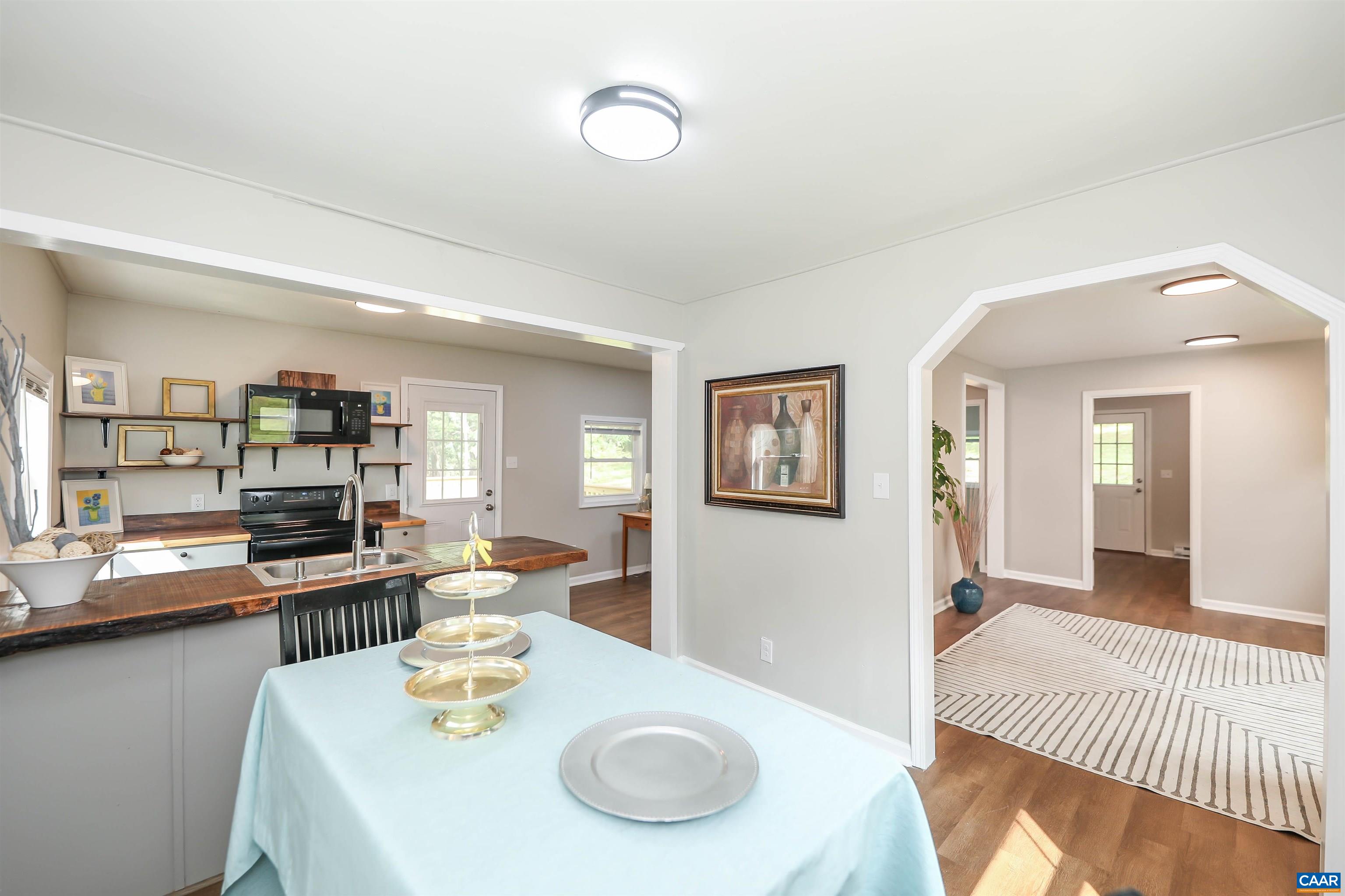 8901 Chestnut Grove Road Esmont, VA 22937 - Photo 1 of 44 a dining room with furniture and wooden floor