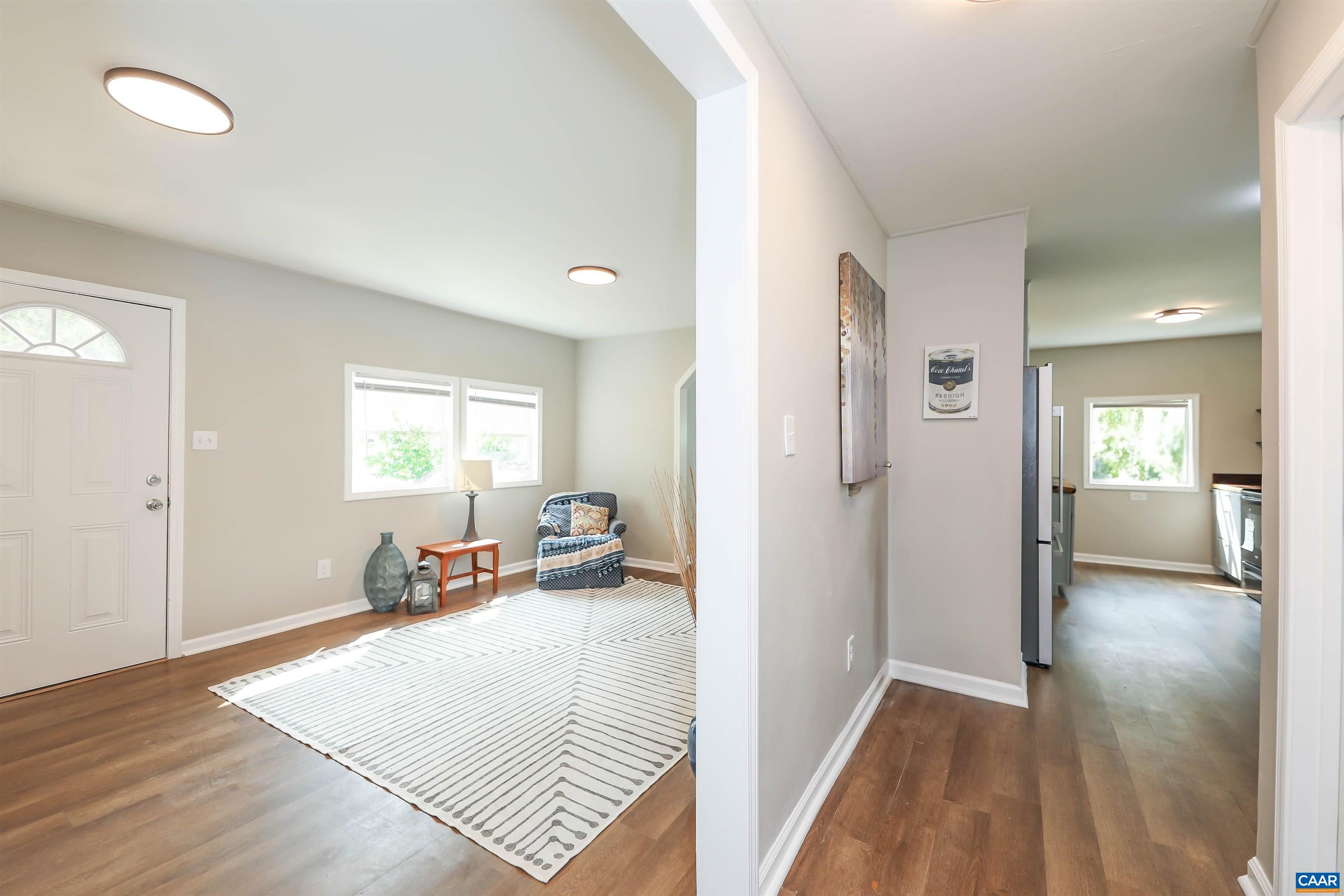 8901 Chestnut Grove Road Esmont, VA 22937 - Photo 12 of 44 a view of a bedroom with wooden floor and a window