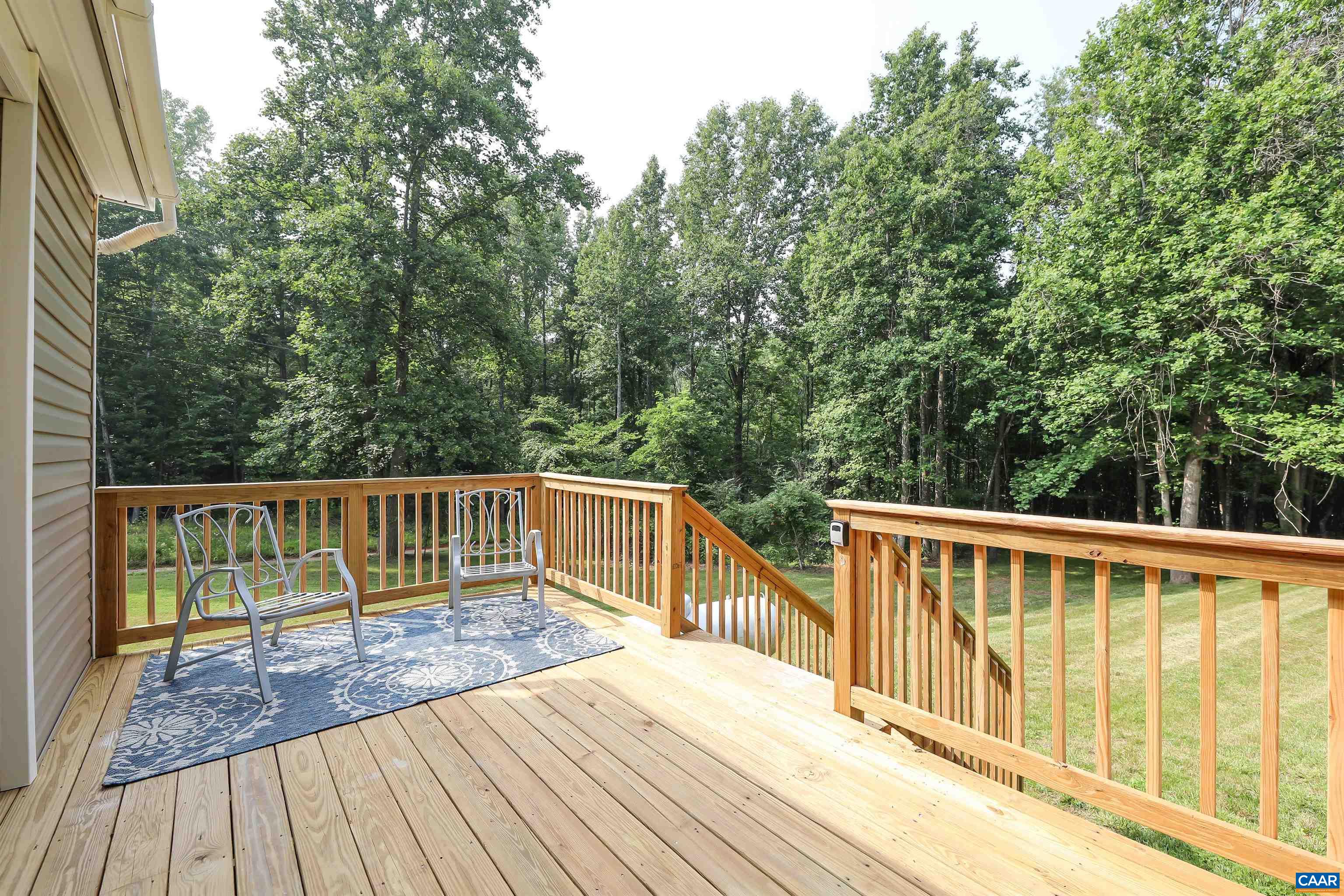 8901 Chestnut Grove Road Esmont, VA 22937 - Photo 18 of 44 a view of balcony with deck and trees