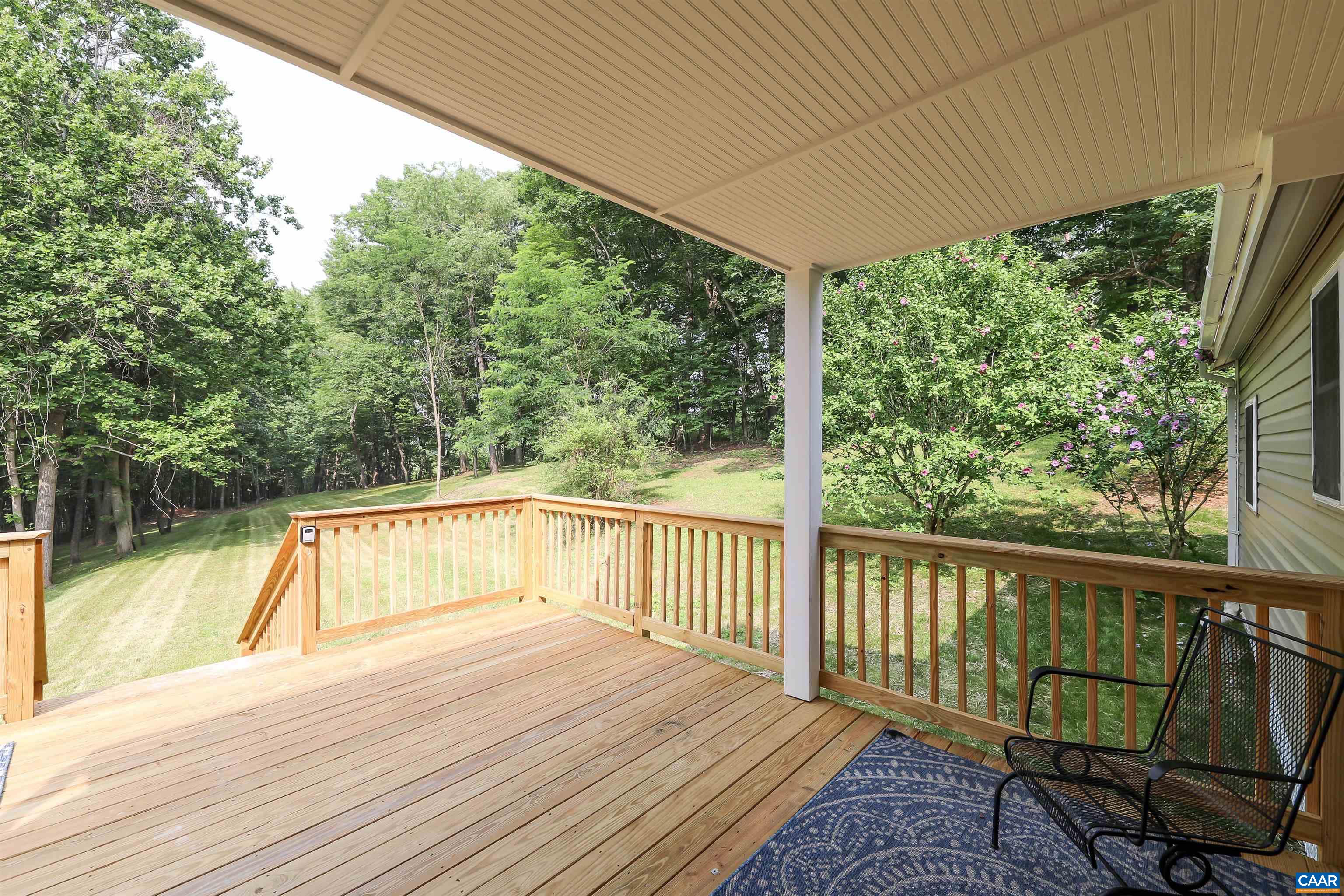 8901 Chestnut Grove Road Esmont, VA 22937 - Photo 19 of 44 a view of deck with wooden floor and outdoor seating