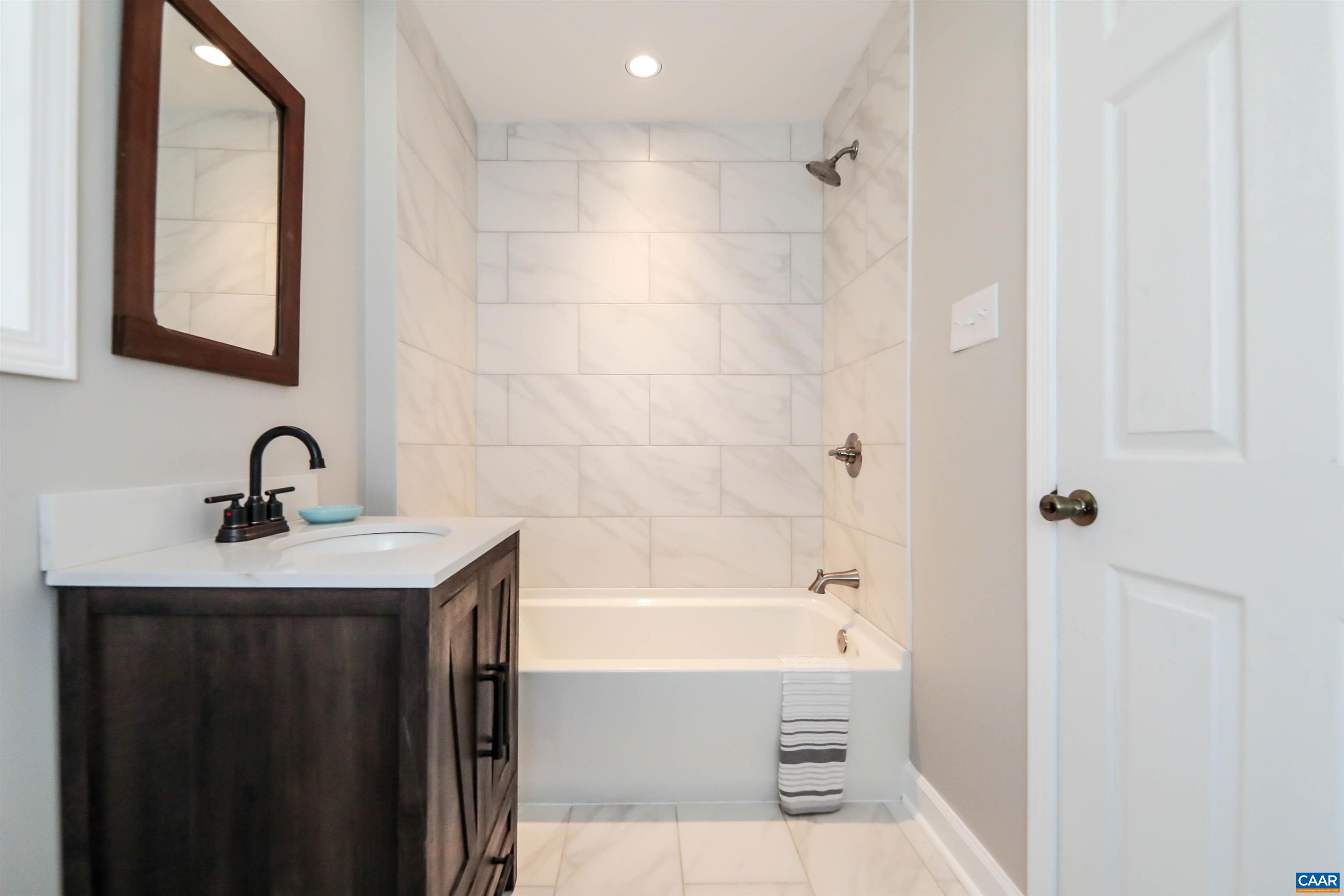 8901 Chestnut Grove Road Esmont, VA 22937 - Photo 21 of 44 a bathroom with a shower and a sink