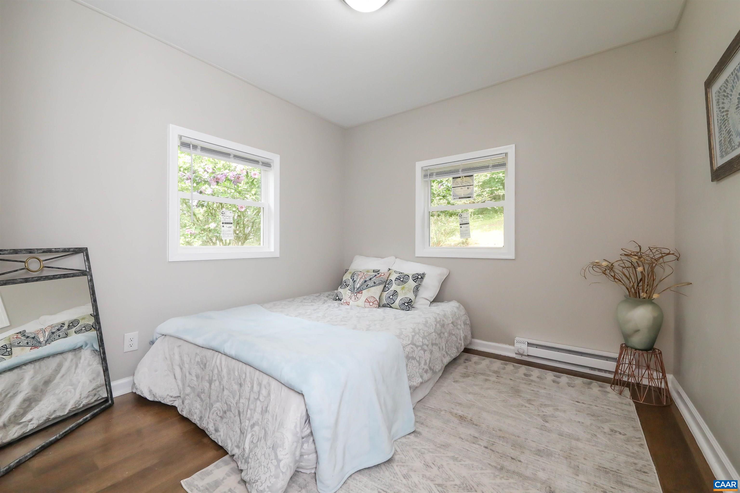 8901 Chestnut Grove Road Esmont, VA 22937 - Photo 22 of 44 a bedroom with a bed and a window