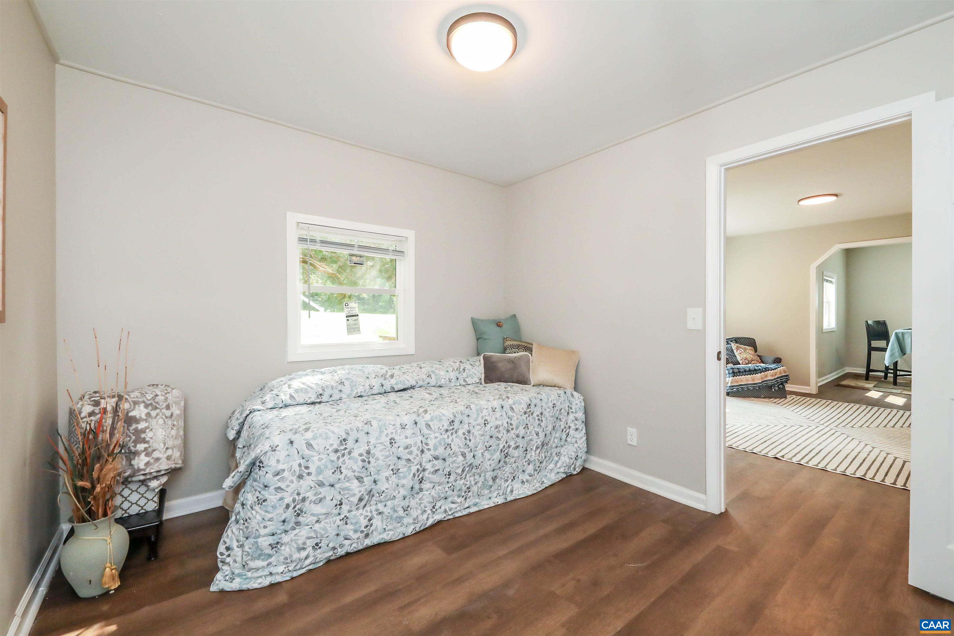 8901 Chestnut Grove Road Esmont, VA 22937 - Photo 24 of 44 a bedroom with a bed and a window