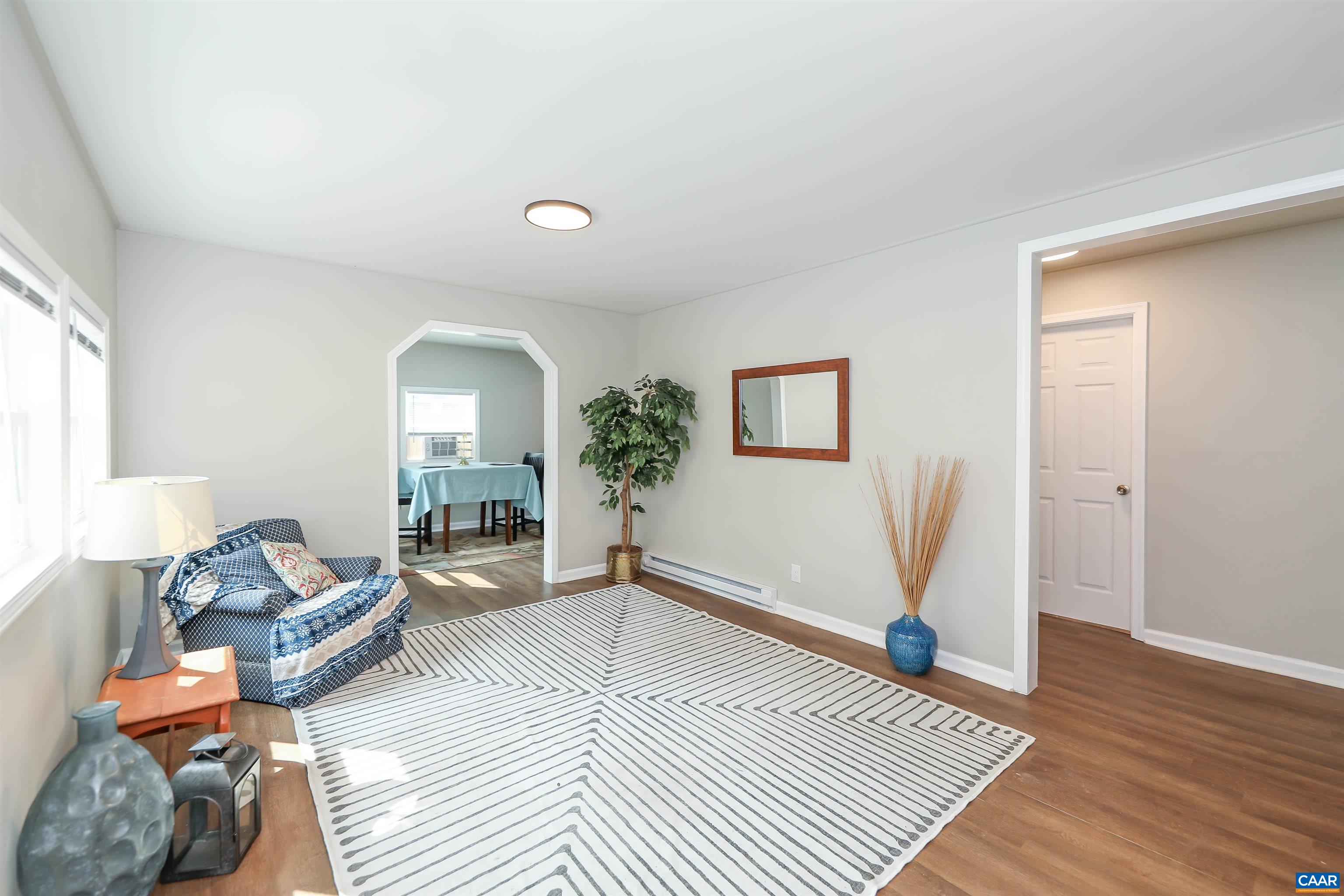 8901 Chestnut Grove Road Esmont, VA 22937 - Photo 3 of 44 a living room with furniture and a wooden floor