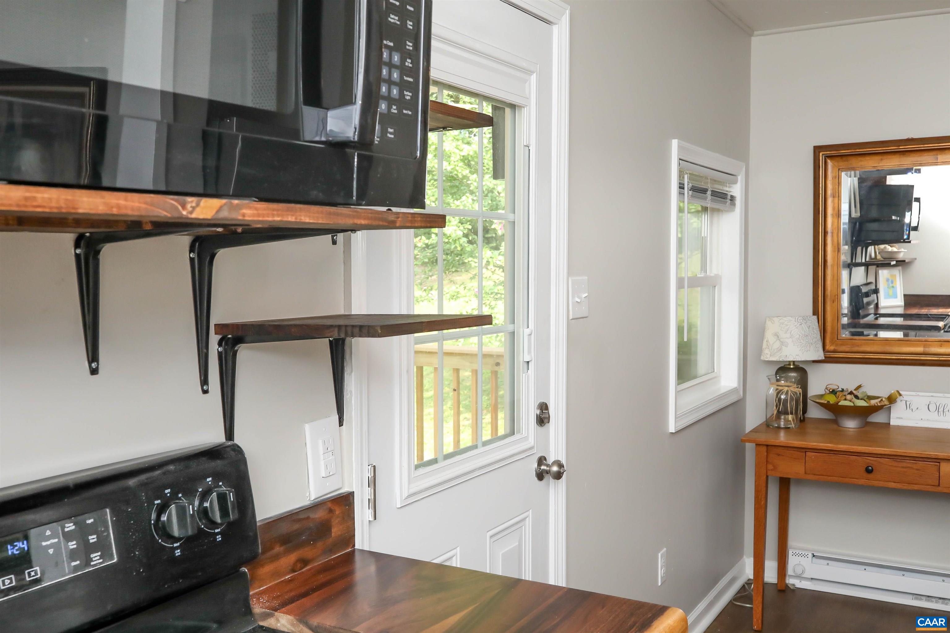 8901 Chestnut Grove Road Esmont, VA 22937 - Photo 33 of 44 a living room with furniture and a window