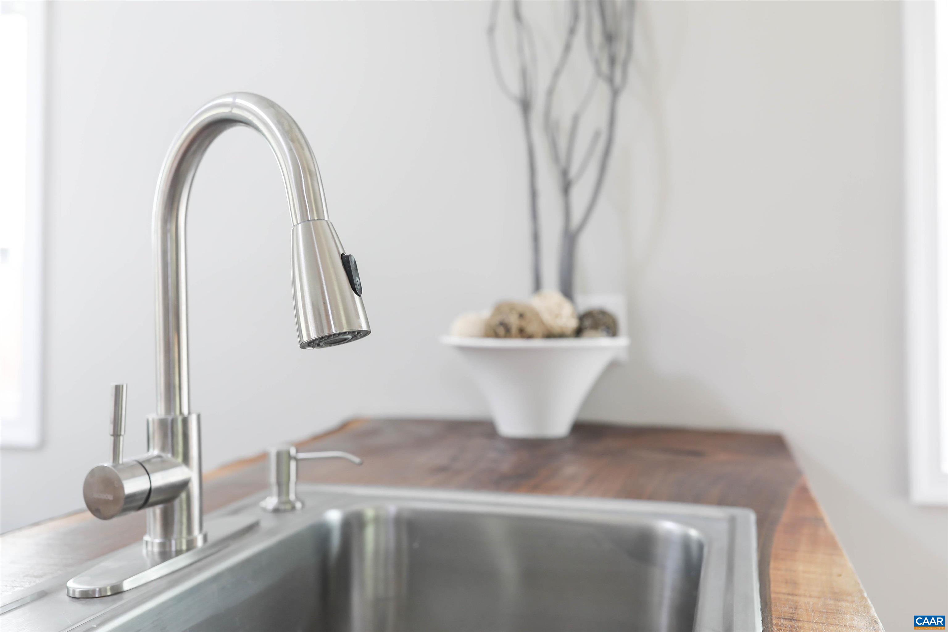 8901 Chestnut Grove Road Esmont, VA 22937 - Photo 35 of 44 a picture of a sink with a potted plant and a potted plant