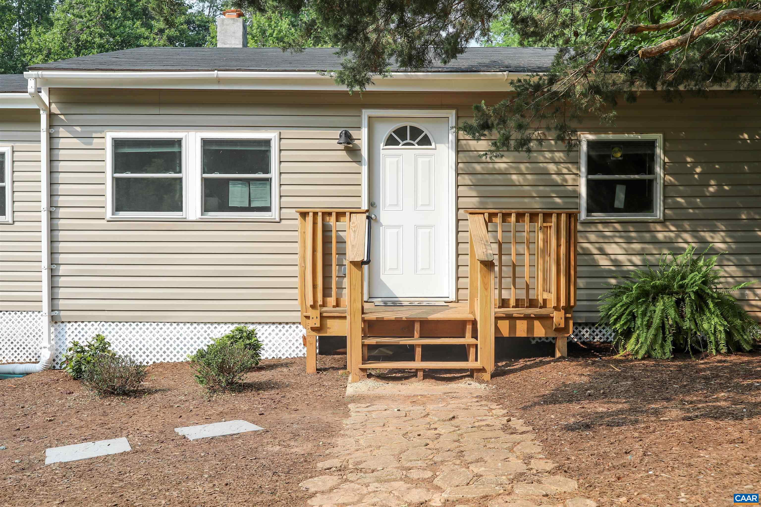 8901 Chestnut Grove Road Esmont, VA 22937 - Photo 38 of 44 a front view of a house with a yard