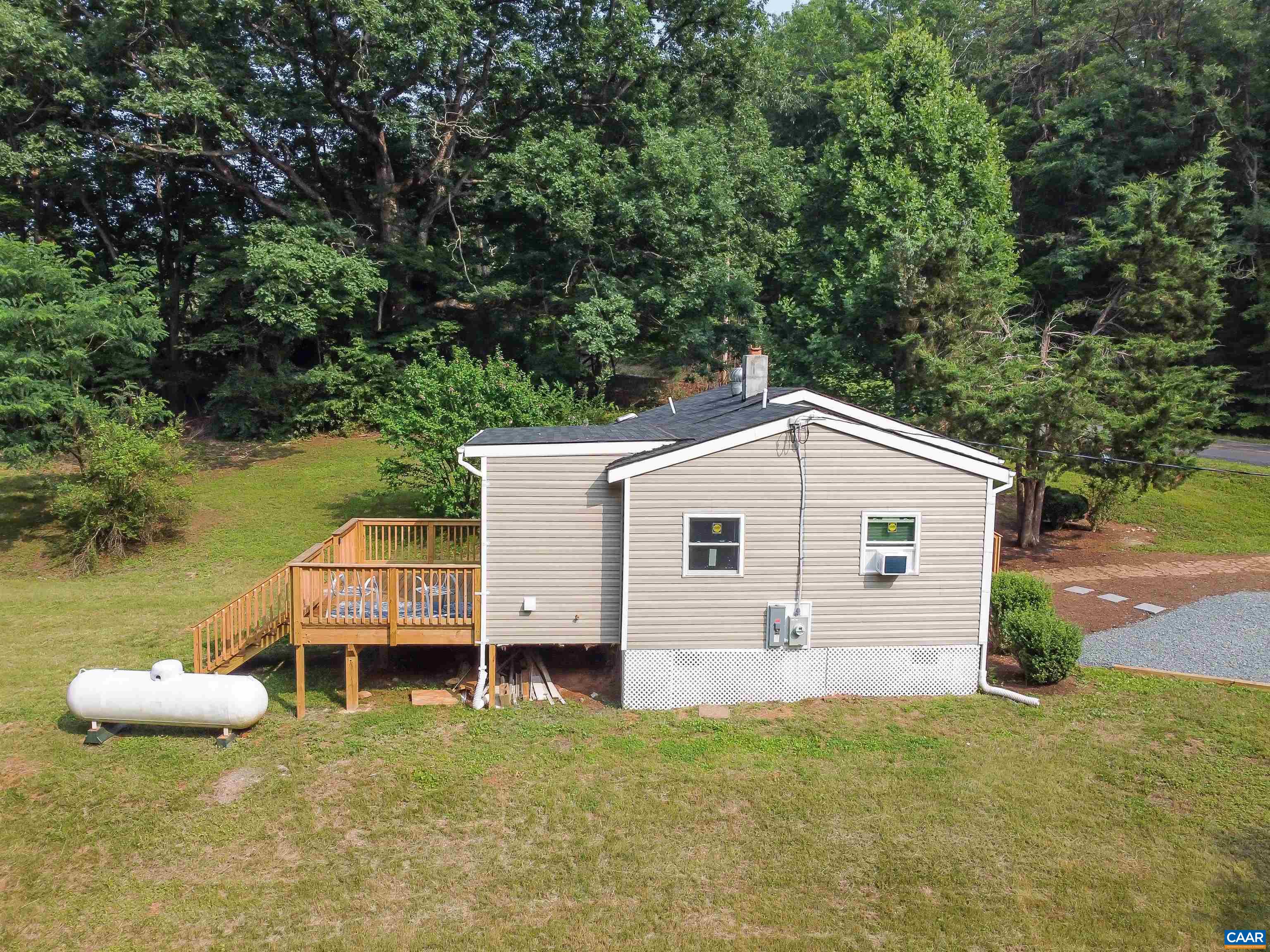 8901 Chestnut Grove Road Esmont, VA 22937 - Photo 40 of 44 a backyard of a house with table and chairs