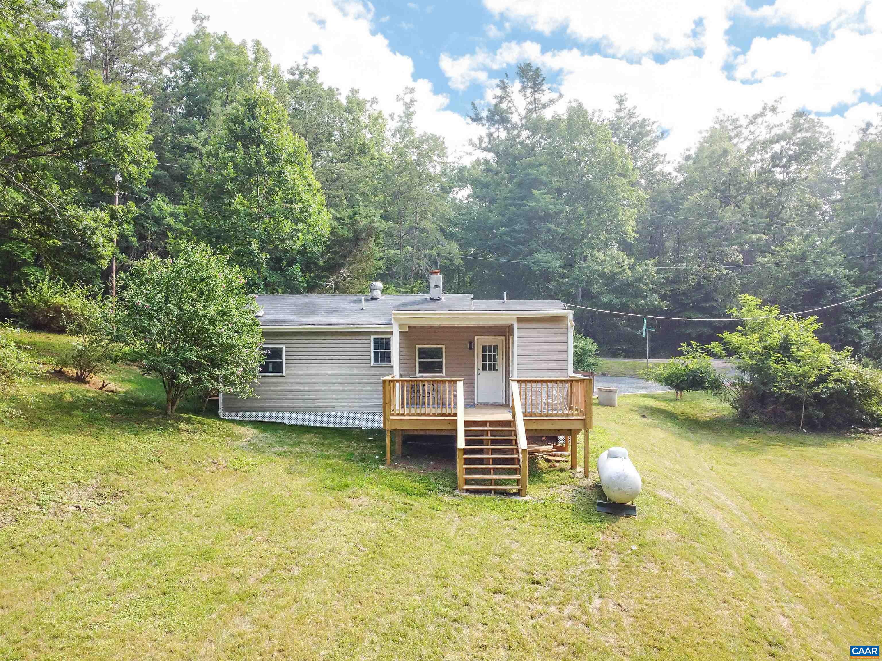 8901 Chestnut Grove Road Esmont, VA 22937 - Photo 42 of 44 a view of a house with pool and a yard