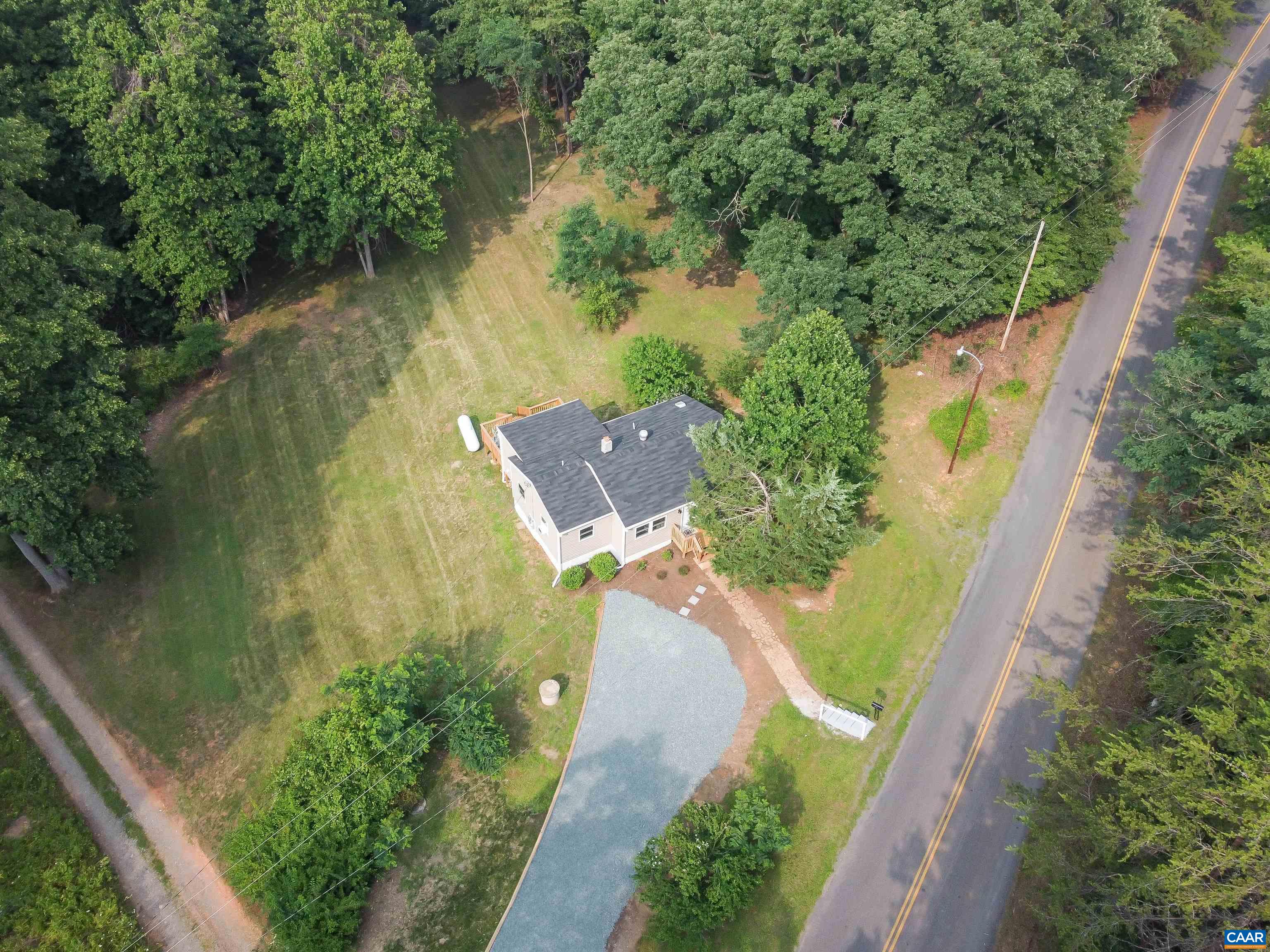 8901 Chestnut Grove Road Esmont, VA 22937 - Photo 44 of 44 an aerial view of a house with a yard