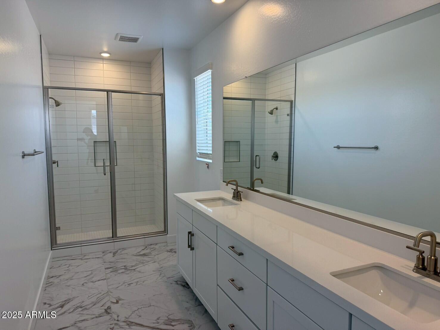 2443 West Rowel Road Phoenix, AZ 85085 - Photo 13 of 19 a bathroom with a sink and a mirror