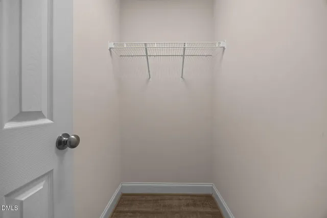 a view of a room with racks on the wall