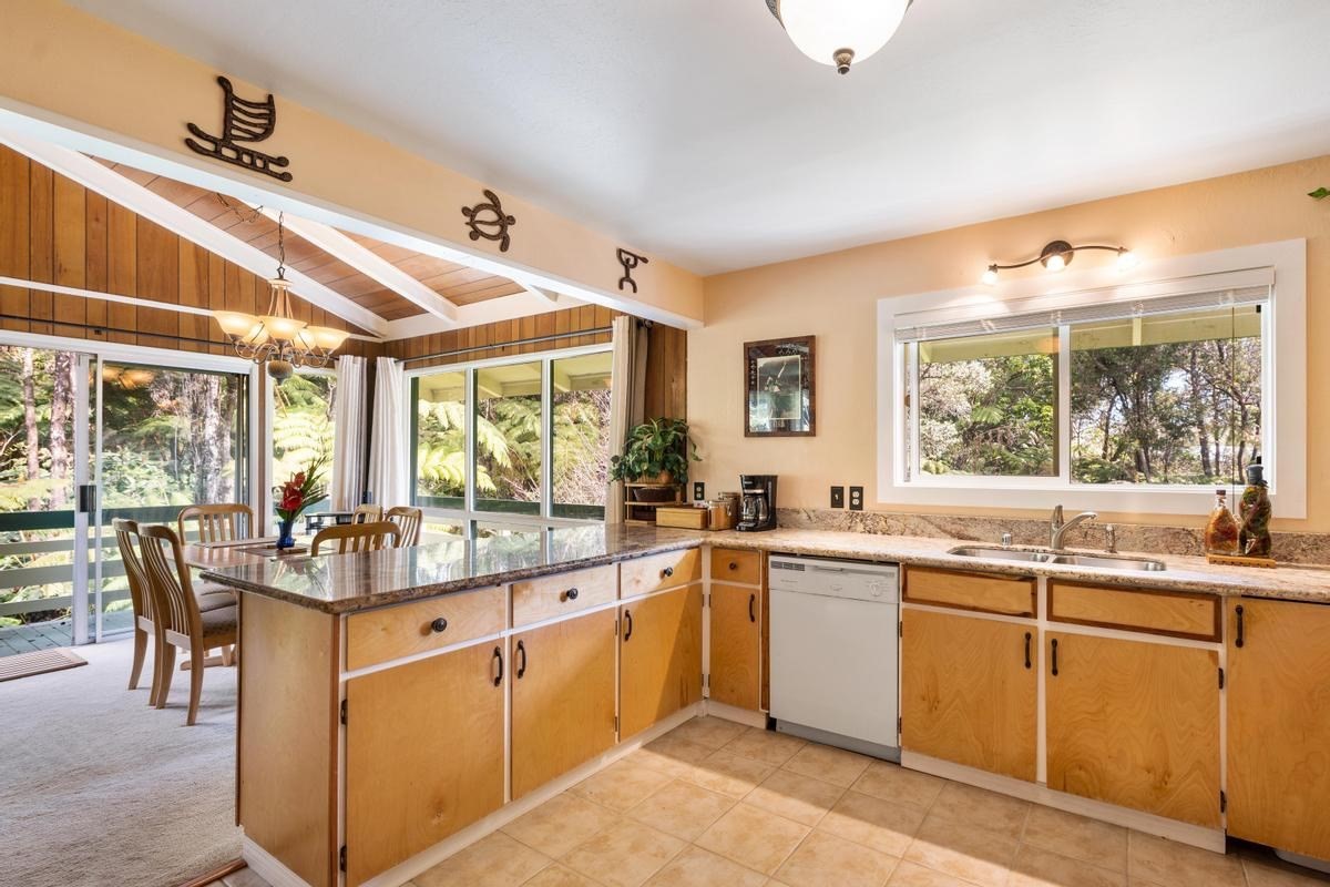 19-4252 Wright Road Volcano, HI 96785 - Photo 14 of 30 a open kitchen with a sink and cabinets